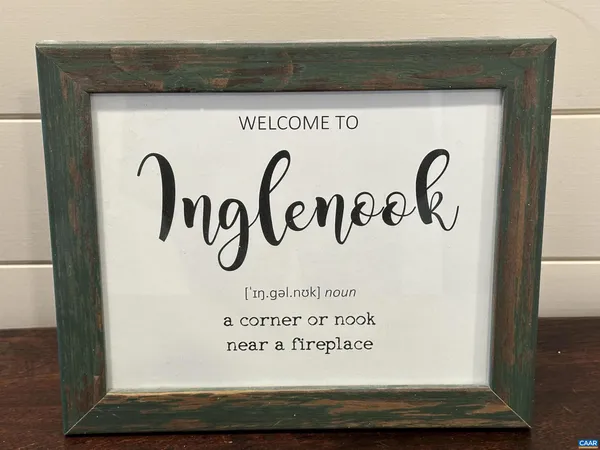 a view of a hallway with windows and entryway