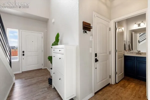 a view of hallway with wooden floor
