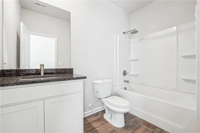 a bathroom with a sink a toilet and a bathtub