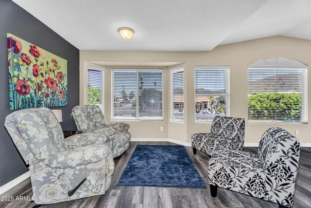 a view of a livingroom with furniture and a window