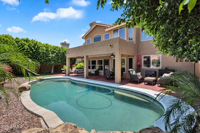 a bed room with a bed and a chandelier