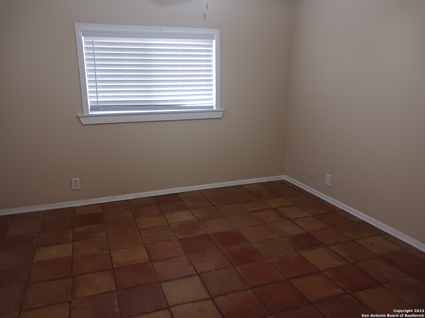 11725 Spring Ridge Drive San Antonio, TX 78249 - Photo 12 of 18 a view of a room that has a window in it