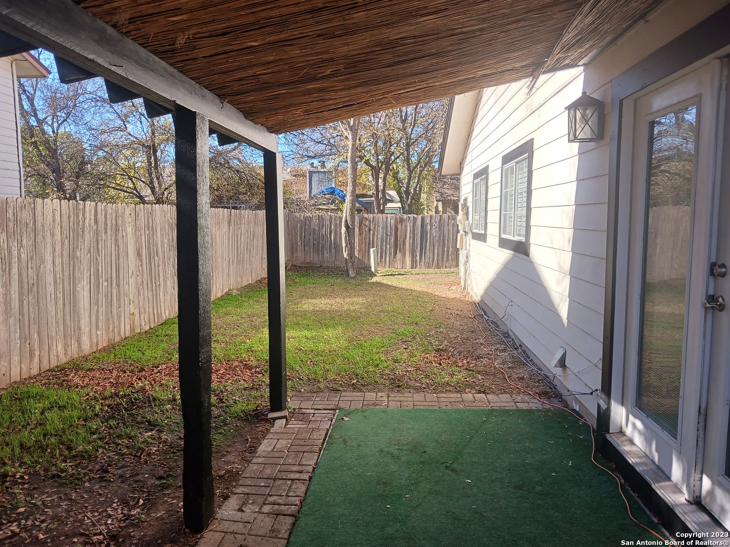 11725 Spring Ridge Drive San Antonio, TX 78249 - Photo 17 of 18 a view of a porch with a backyard