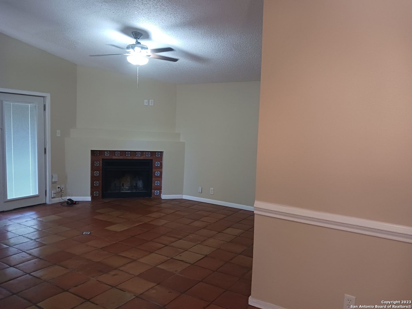11725 Spring Ridge Drive San Antonio, TX 78249 - Photo 4 of 18 a view of an empty room with a fireplace
