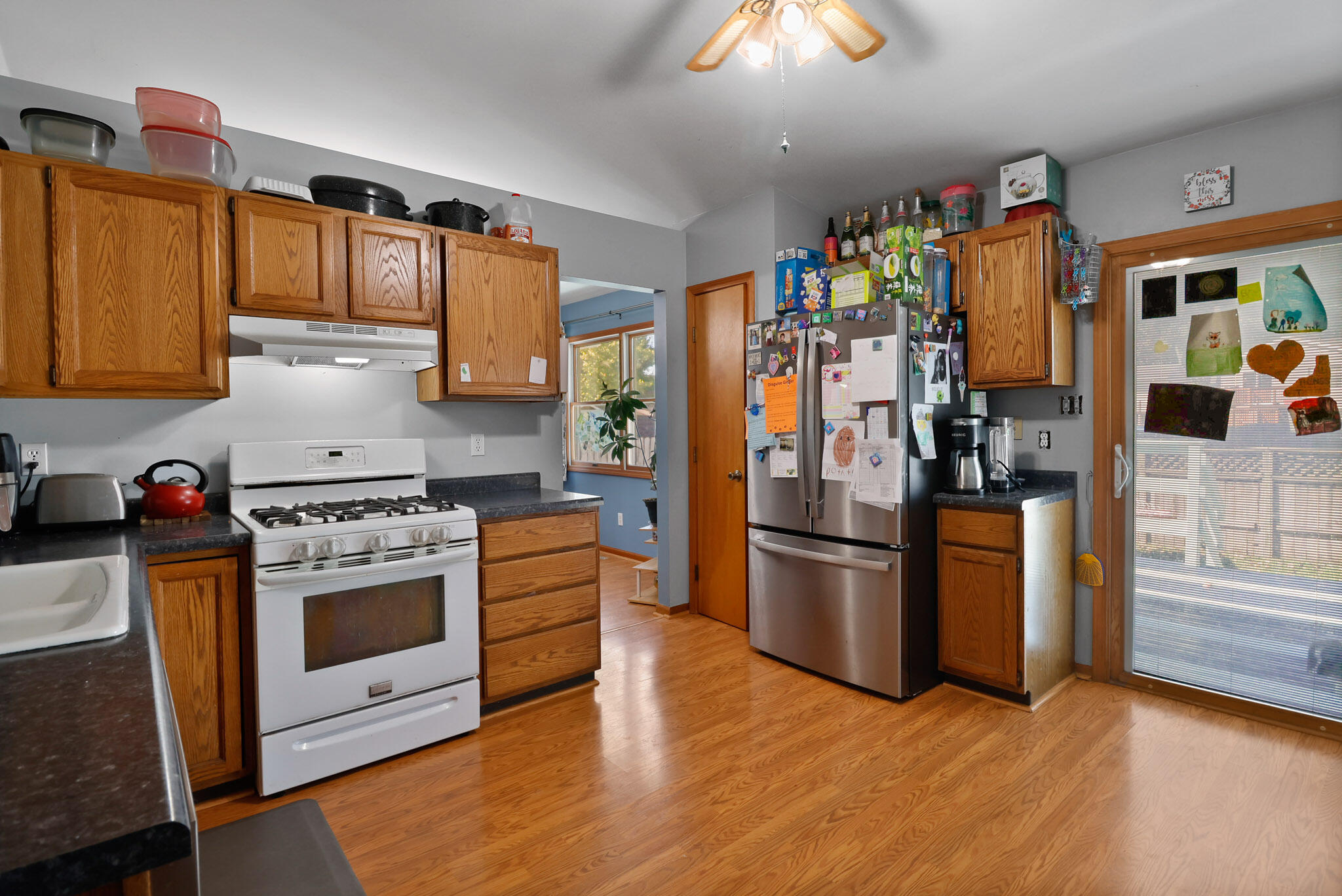 3712 Baldwin Street Portage, IN 46368 - Photo 9 of 26 a kitchen with stainless steel appliances granite countertop a refrigerator stove and sink