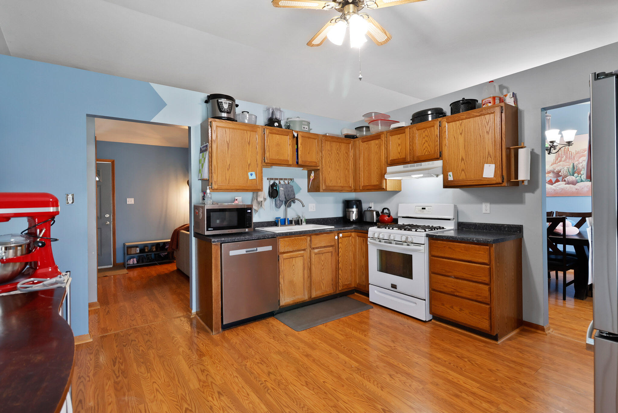 3712 Baldwin Street Portage, IN 46368 - Photo 10 of 26 a kitchen with stainless steel appliances a stove a sink dishwasher and a refrigerator