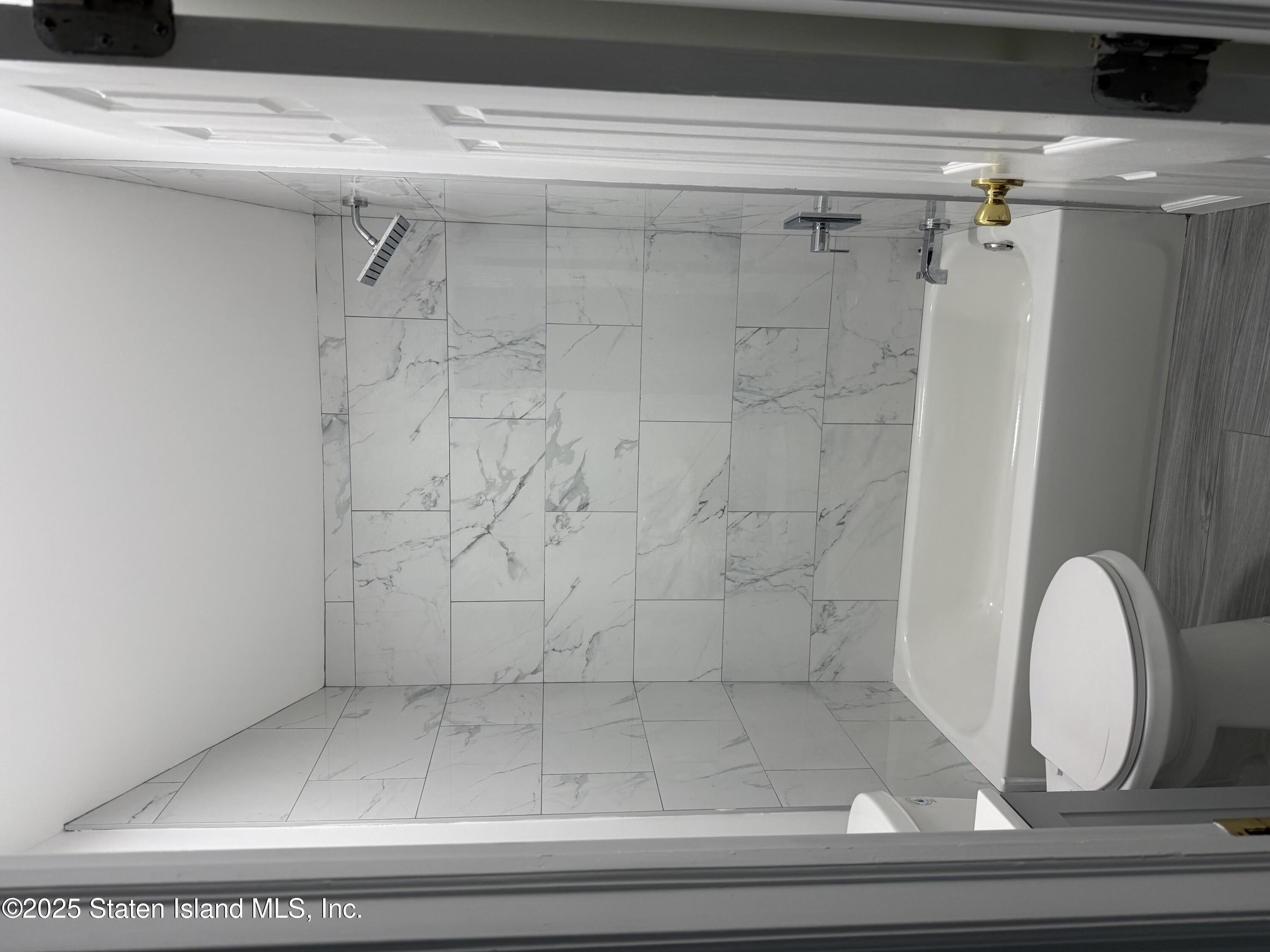 348 Targee Street Staten Island, NY 10304 - Photo 7 of 7 a bathroom with a shower