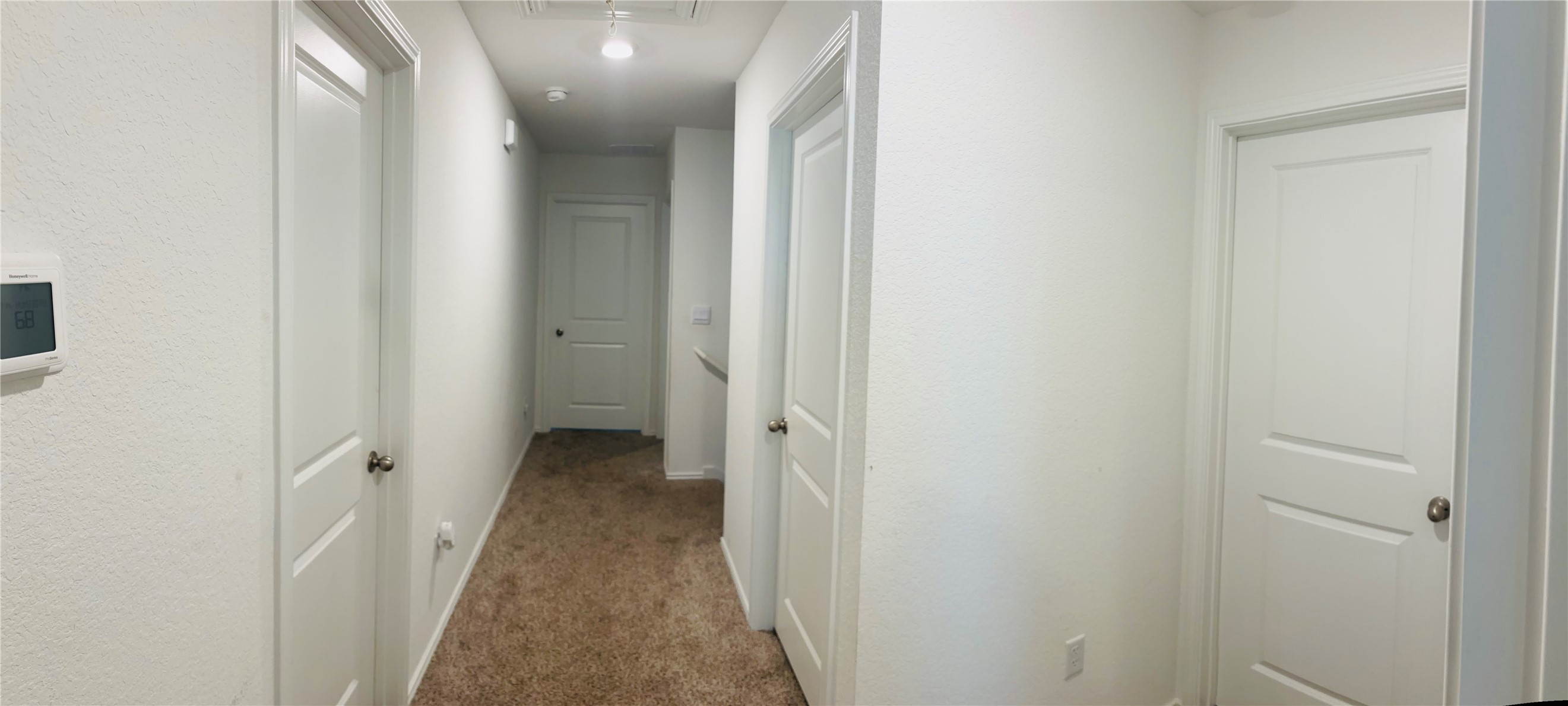 14817 Perlino Way, Unit A Manor, TX 78653 - Photo 15 of 40 a view of a hallway with wooden floor