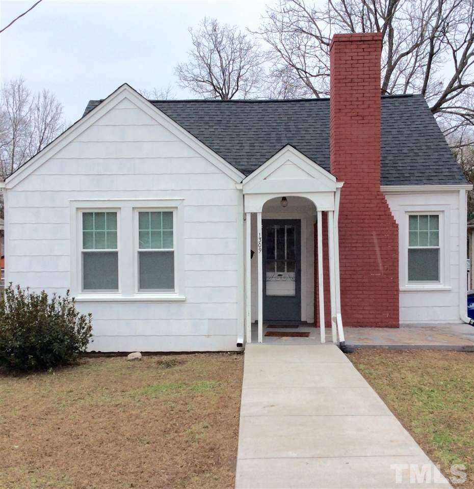 1309 Lake Wheeler Road Raleigh, NC 27603 - Photo 1 of 17 a front view of a house with yard