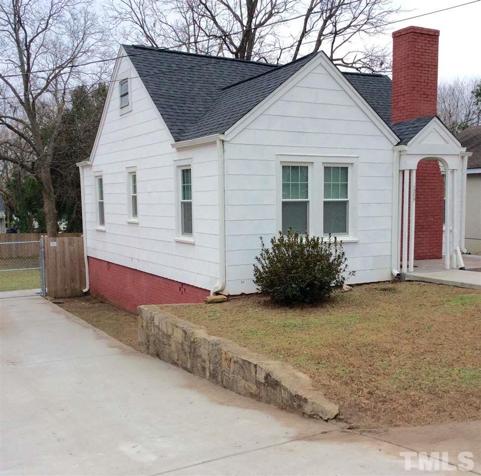 1309 Lake Wheeler Road Raleigh, NC 27603 - Photo 2 of 17 a view of a house with a yard and potted plants