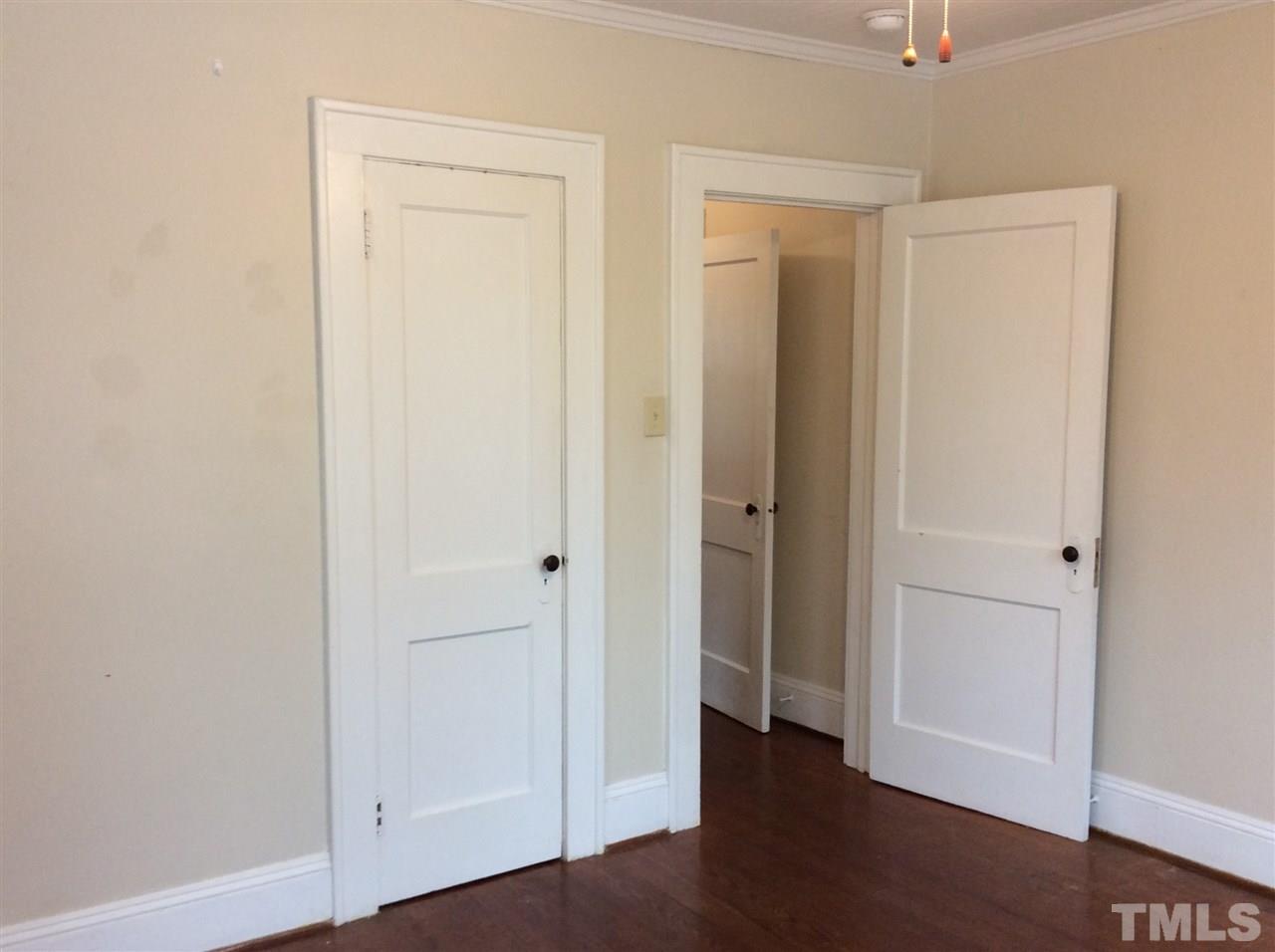 1309 Lake Wheeler Road Raleigh, NC 27603 - Photo 13 of 17 an empty room with wooden floor and closet