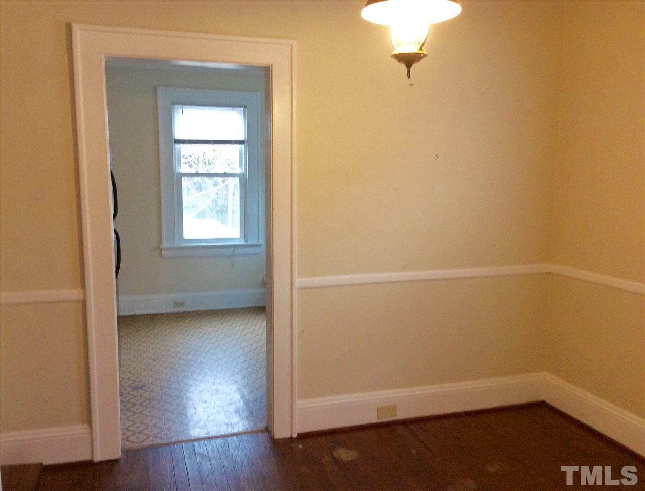 1309 Lake Wheeler Road Raleigh, NC 27603 - Photo 7 of 17 a view of a small space with wooden floor and a window