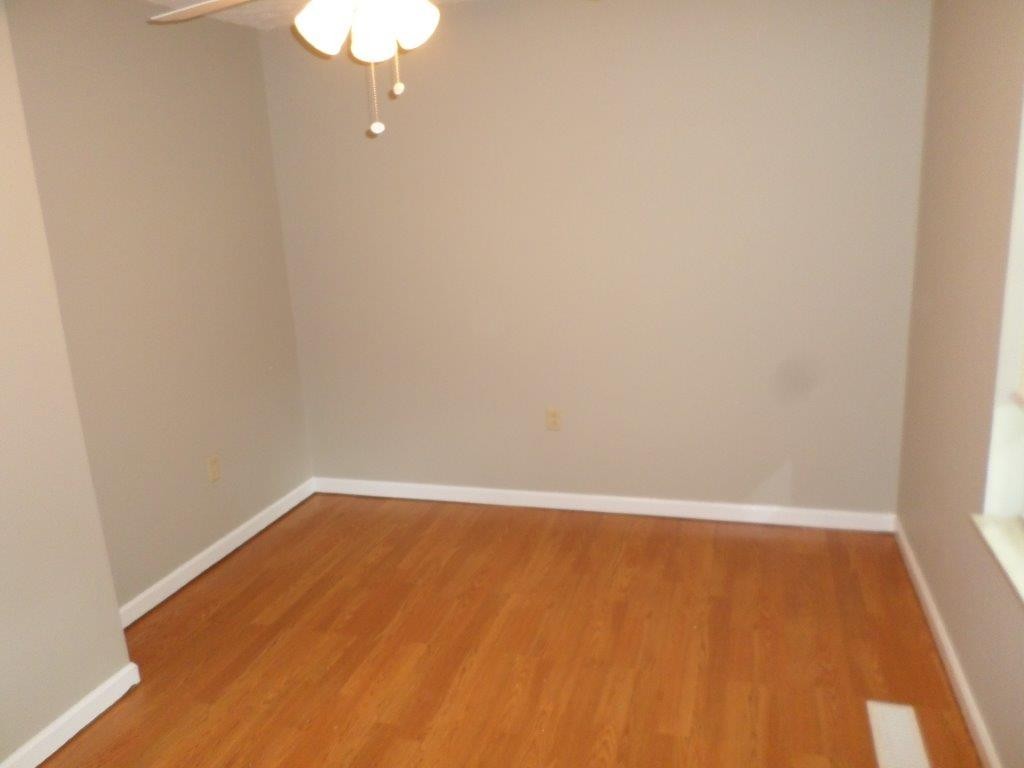 10705 McBee Mill Road Corryton, TN 37721 - Photo 11 of 20 a view of an empty room with wooden floor