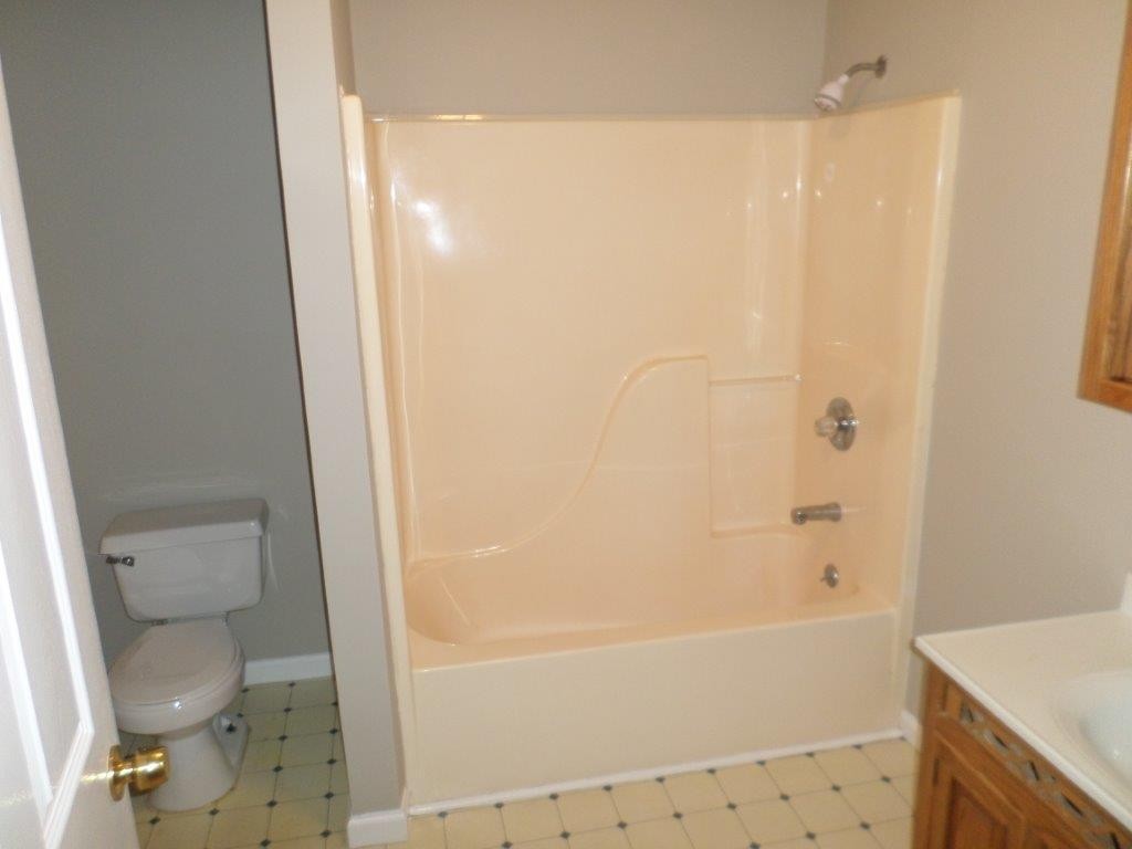 10705 McBee Mill Road Corryton, TN 37721 - Photo 10 of 20 a bathroom with a bathtub and a shower