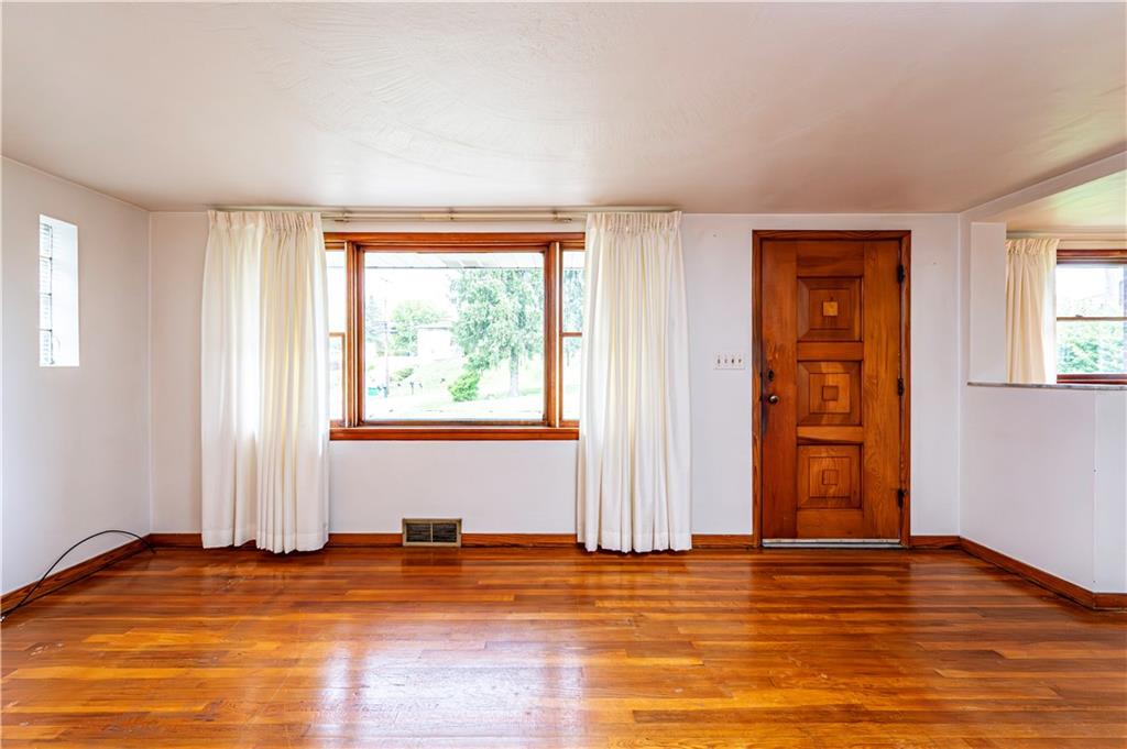 13740 Ridge Road Irwin, PA 15642 - Photo 6 of 43 a view of empty room with wooden floor and fan