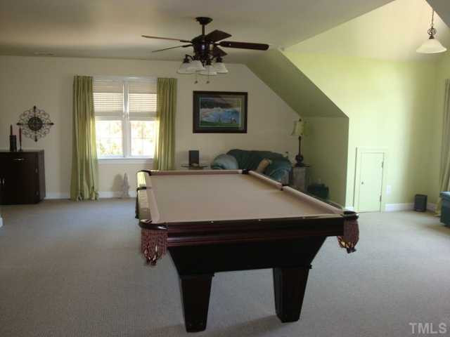2845 Anfield Road Raleigh, NC 27606 - Photo 14 of 25 Oversized Bonus Room with Large Dormer Provides Ample Space for Pool Table and Furniture Bonus Room