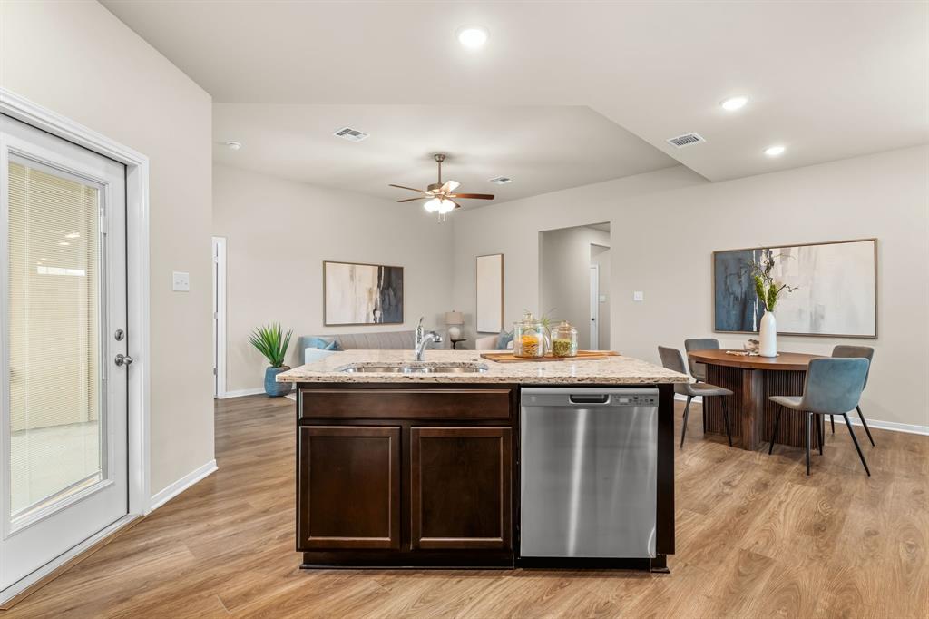 11233 Solar Street Lorena, TX 76655 - Photo 13 of 33 pantry; kitchen island; seamless flow to dining area and living area