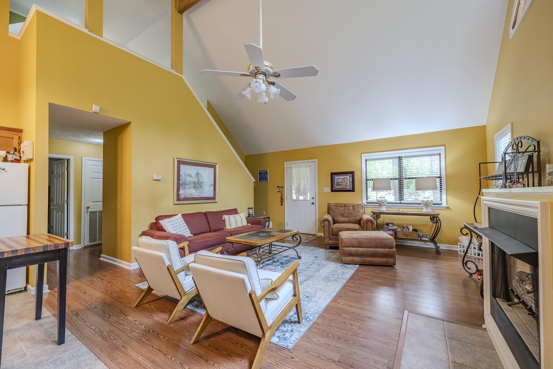 405 Murray Lane Counce, TN 38326 - Photo 9 of 36 a living room with fireplace furniture and a window