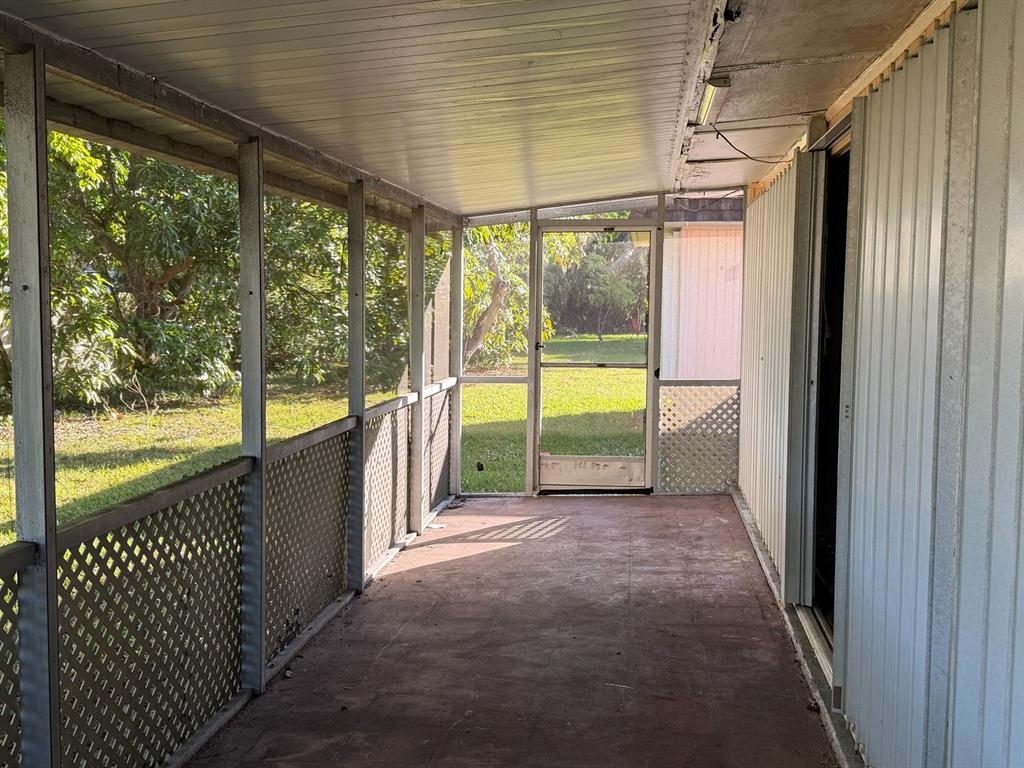 7101 Northwest 68th Street Tamarac, FL 33321 - Photo 11 of 12 a view of a porch