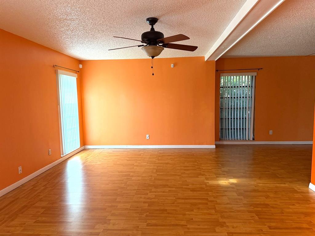 7101 Northwest 68th Street Tamarac, FL 33321 - Photo 2 of 12 a view of an empty room with windows