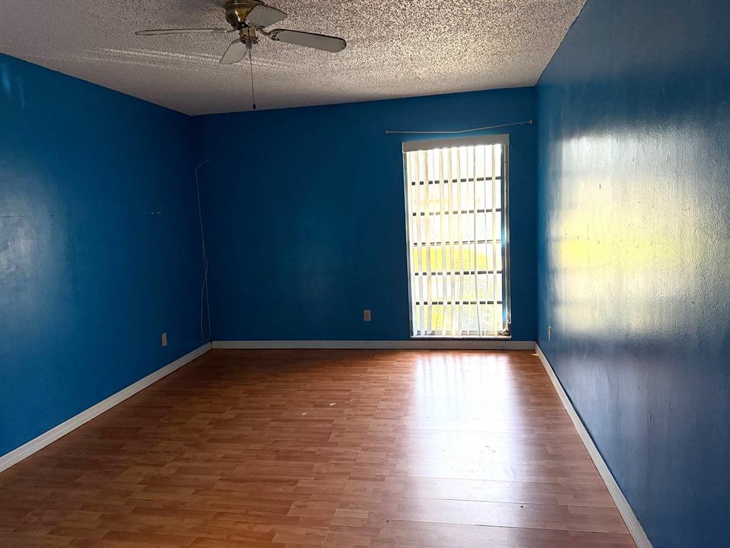 7101 Northwest 68th Street Tamarac, FL 33321 - Photo 8 of 12 a view of an empty room and window