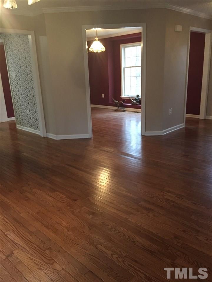 241 Shannon Road Timberlake, NC 27583 - Photo 13 of 17 a view of room with window and wooden floor