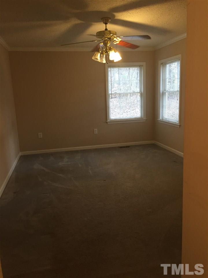 241 Shannon Road Timberlake, NC 27583 - Photo 3 of 17 a view of an empty room with a window