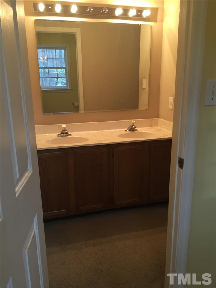 241 Shannon Road Timberlake, NC 27583 - Photo 4 of 17 a bathroom with a sink and a mirror