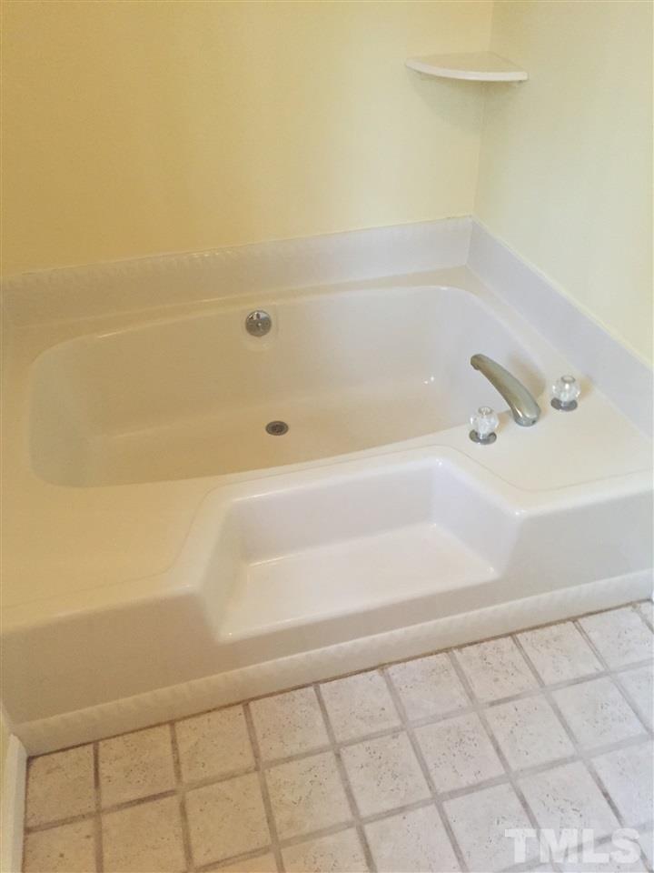 241 Shannon Road Timberlake, NC 27583 - Photo 6 of 17 a bathroom with a bathtub