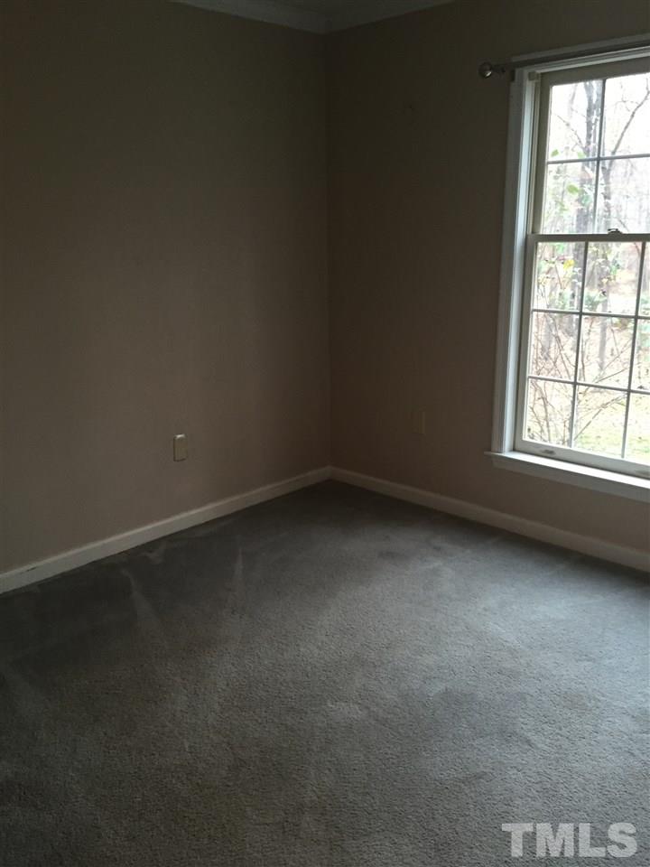 241 Shannon Road Timberlake, NC 27583 - Photo 10 of 17 an empty room with a window