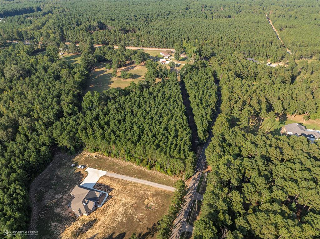 190 Linton Bellevue Road Benton, LA 71006 - Photo 13 of 13 Aerial view of property and surrounding area featuring a heavily wooded area