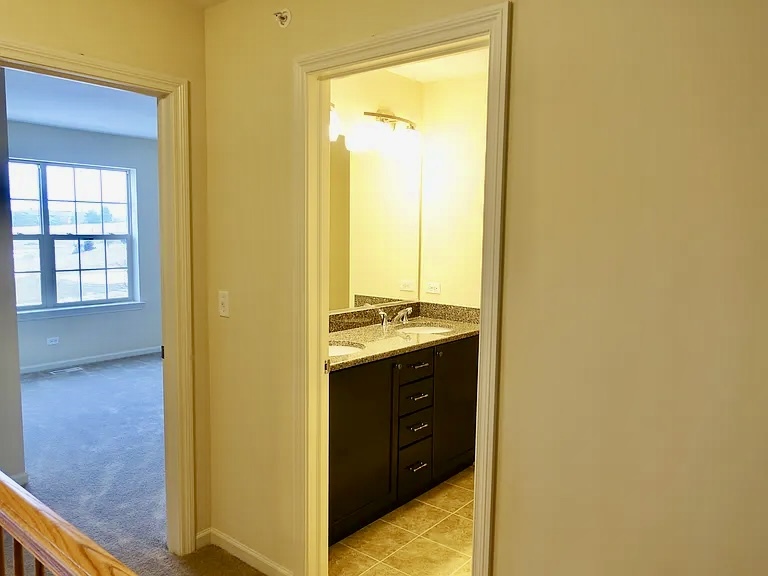 2018 Shermer Road, Unit 2018 Glenview, IL 60026 - Photo 30 of 39 a view of walk in closet and bedroom