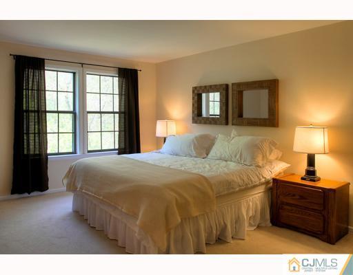 3406 Springbrook Drive Edison, NJ 08820 - Photo 7 of 10 a bedroom with a bed and a window
