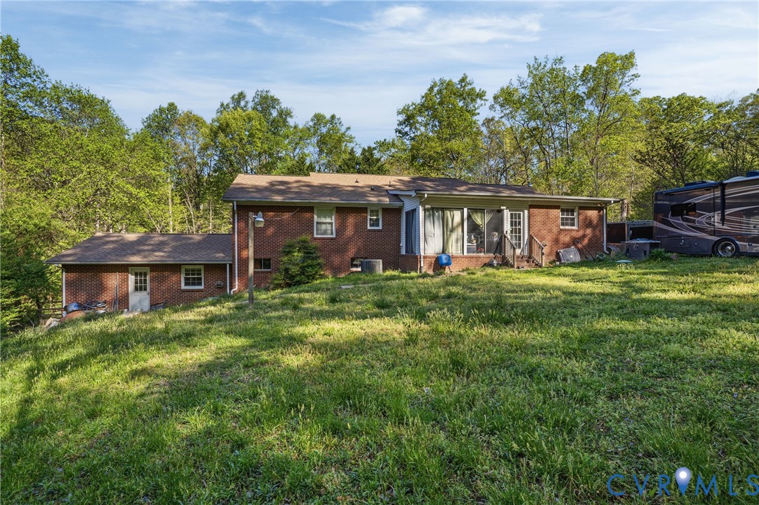 14219 Spruce Avenue Chester, VA 23836 - Photo 31 of 32 a front view of house with yard and green space