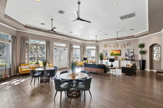 a bedroom with a bed and a potted plant