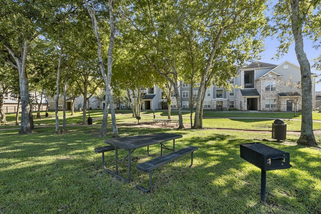 3101 Vista Drive, Unit A2 Rosenberg, TX 77471 - Photo 8 of 10 a view of a park with bench and trees