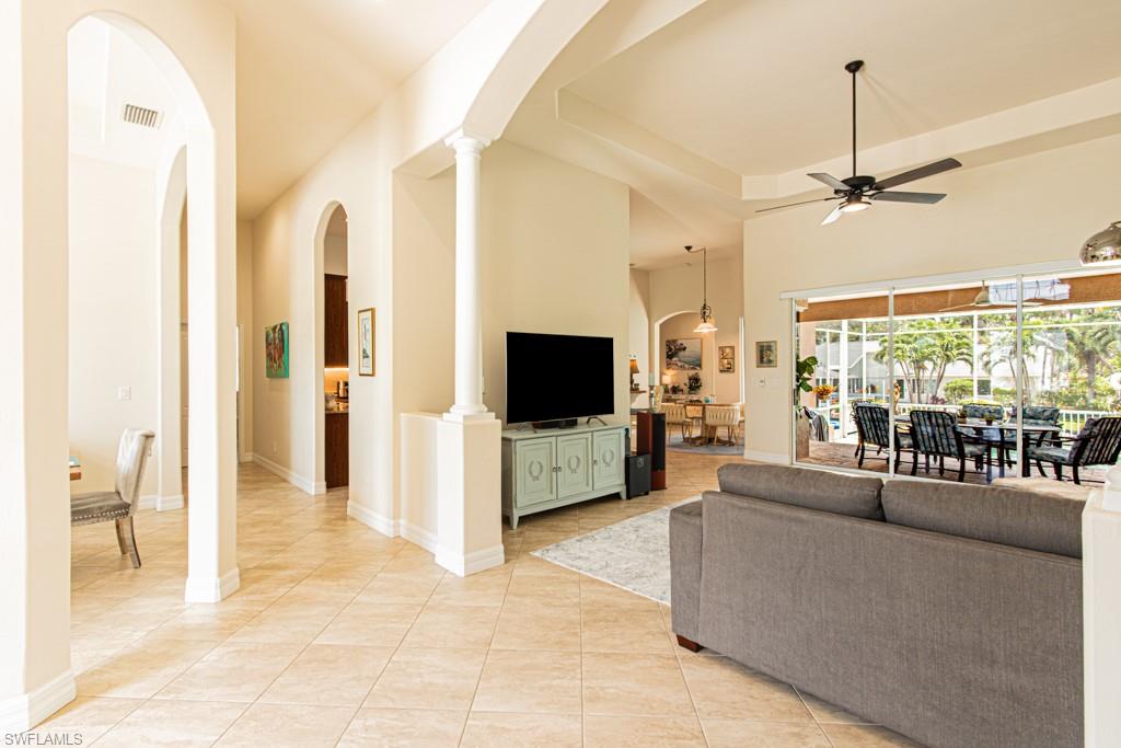 27151 Mora Road Bonita Springs, FL 34135 - Photo 15 of 50 a living room with furniture and a flat screen tv