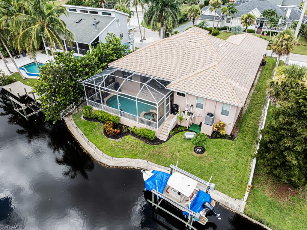27151 Mora Road Bonita Springs, FL 34135 - Photo 2 of 50 an aerial view of a house with a yard table and chairs