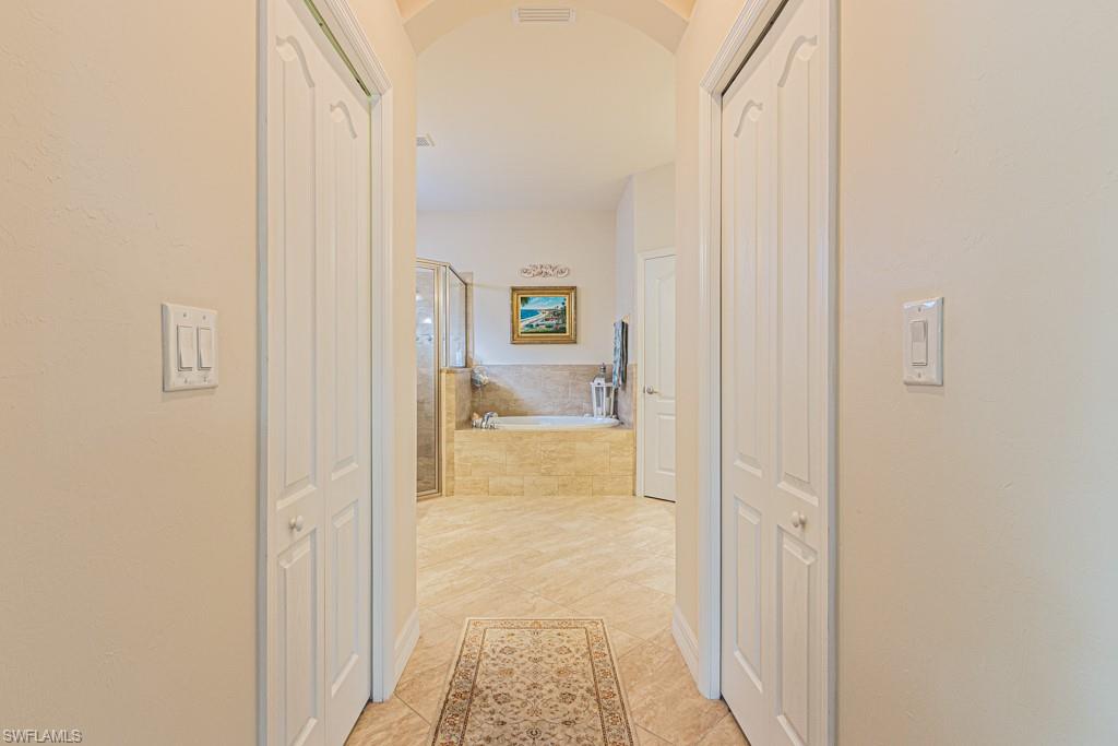 27151 Mora Road Bonita Springs, FL 34135 - Photo 23 of 50 a view of a bathroom from the hallway