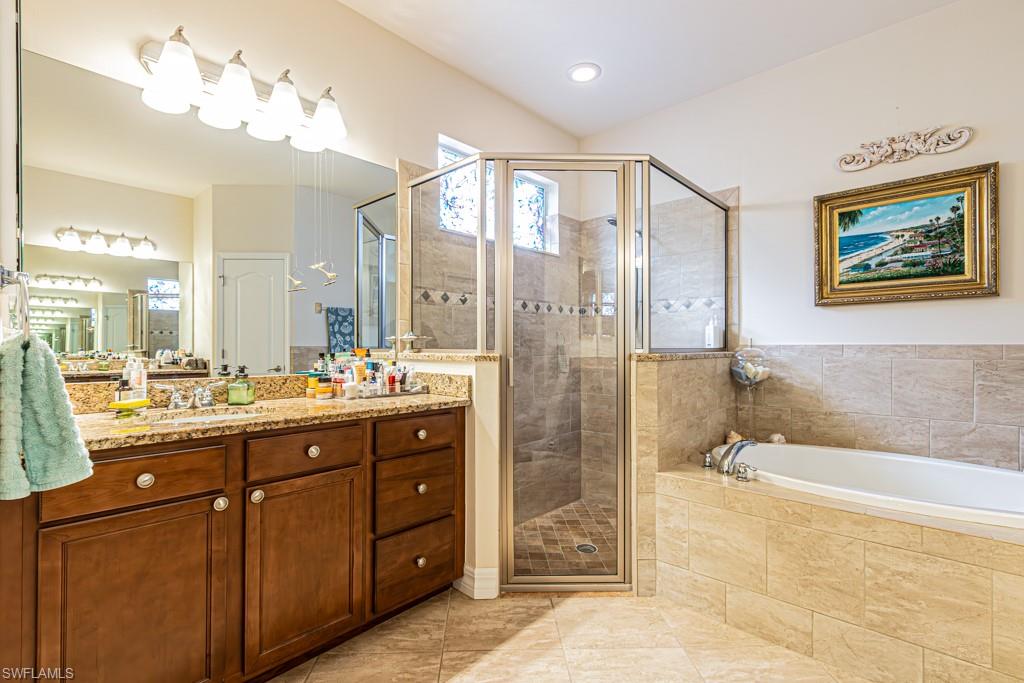 27151 Mora Road Bonita Springs, FL 34135 - Photo 24 of 50 a bathroom with a double vanity sink mirror and double