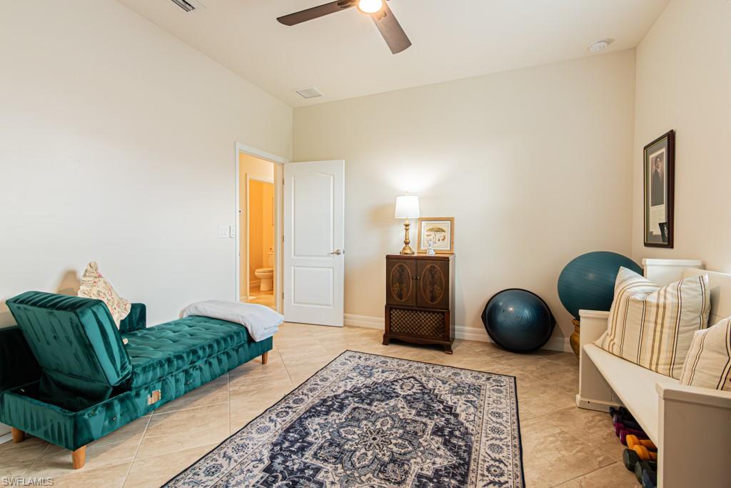 27151 Mora Road Bonita Springs, FL 34135 - Photo 27 of 50 a living room with furniture and a rug