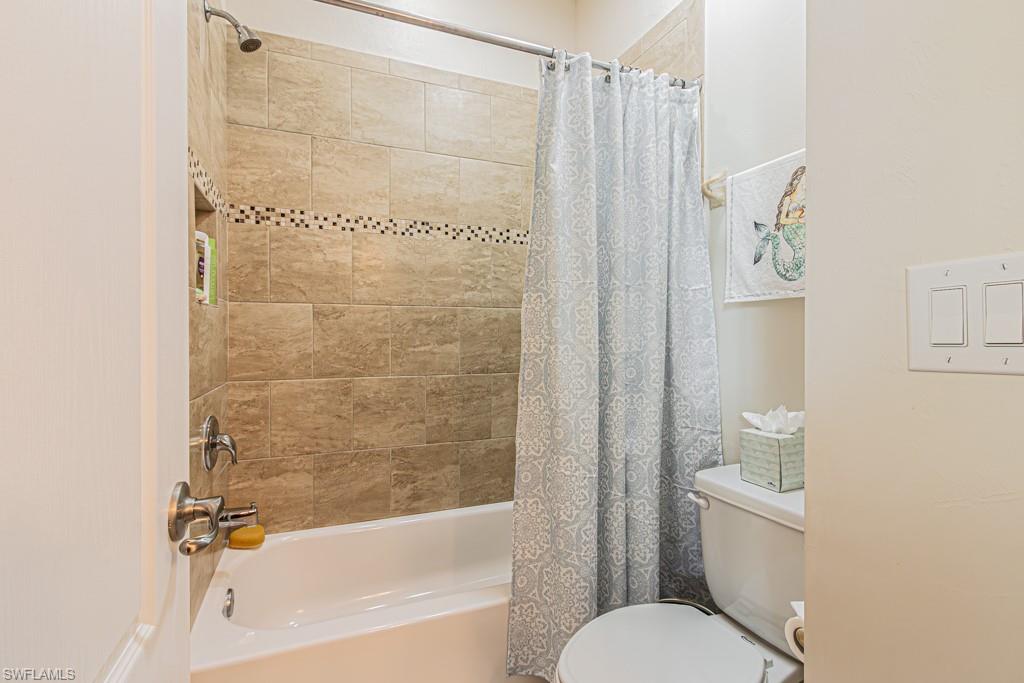 27151 Mora Road Bonita Springs, FL 34135 - Photo 29 of 50 a bathroom with a shower and a toilet