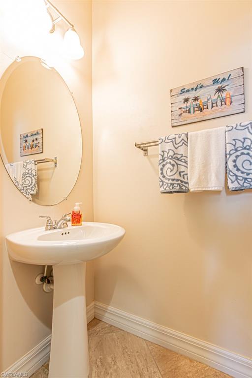 27151 Mora Road Bonita Springs, FL 34135 - Photo 36 of 50 a bathroom with a sink and a mirror