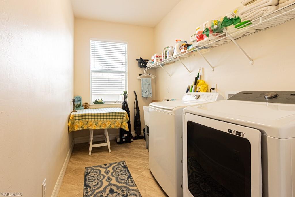 27151 Mora Road Bonita Springs, FL 34135 - Photo 38 of 50 a utility room with dryer and washer