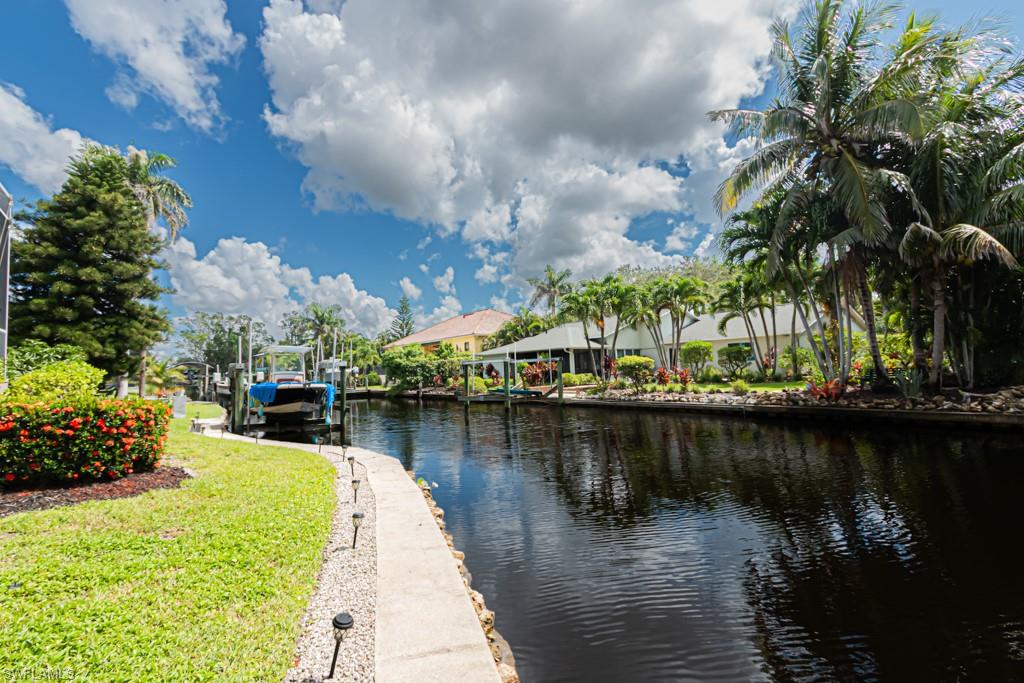 27151 Mora Road Bonita Springs, FL 34135 - Photo 44 of 50 a view of a lake with a house in the background