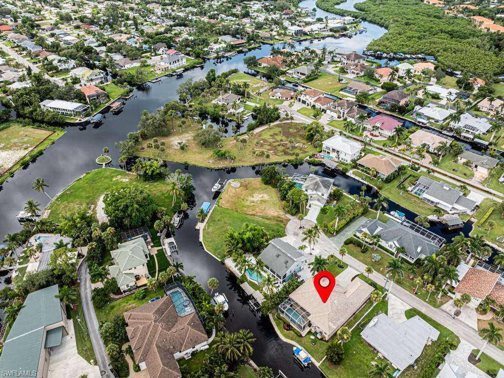 27151 Mora Road Bonita Springs, FL 34135 - Photo 46 of 50 an aerial view of residential houses with outdoor space