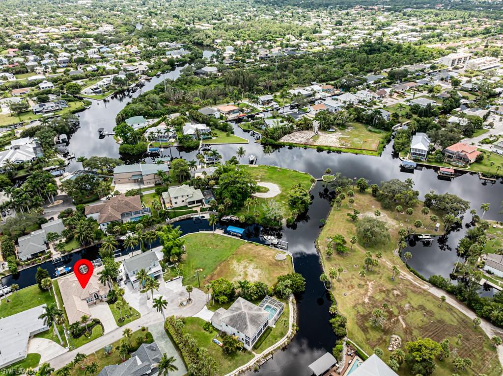 27151 Mora Road Bonita Springs, FL 34135 - Photo 47 of 50 an aerial view of residential houses with outdoor space