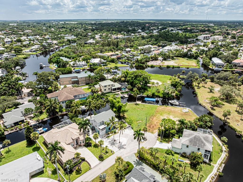 27151 Mora Road Bonita Springs, FL 34135 - Photo 48 of 50 an aerial view of residential houses with outdoor space