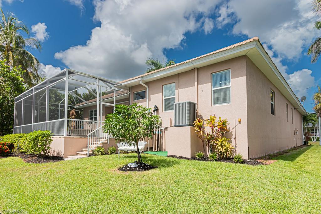 27151 Mora Road Bonita Springs, FL 34135 - Photo 50 of 50 a front view of a house with garden