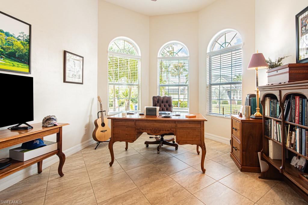 27151 Mora Road Bonita Springs, FL 34135 - Photo 8 of 50 a view of a livingroom with workspace and a window